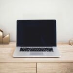 A laptop on a desk.
