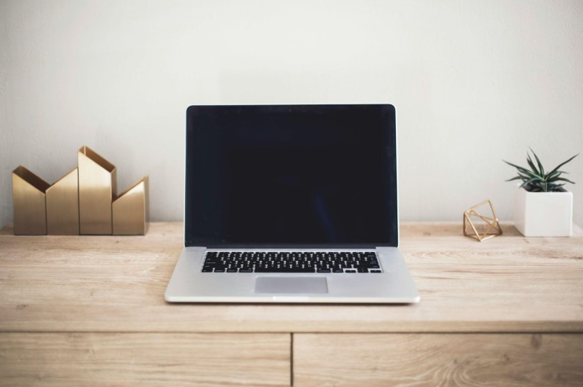 A laptop on a desk.